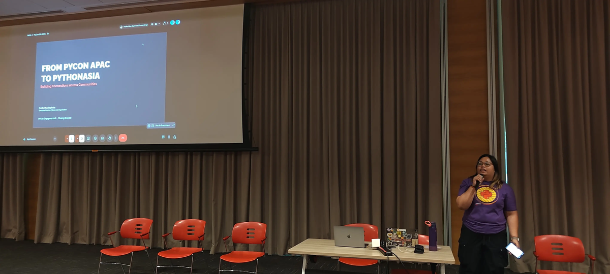 Photograph of Freilla Mae Espinola at a presentation titled "FROM PYCON APAC TO PYTHONASIA" for PyCon SG 2026